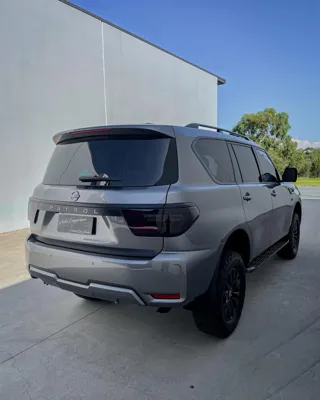 Grey Nissan Patrol rear quarter showing gloss paint protection after mobile car detailing in Caloundra