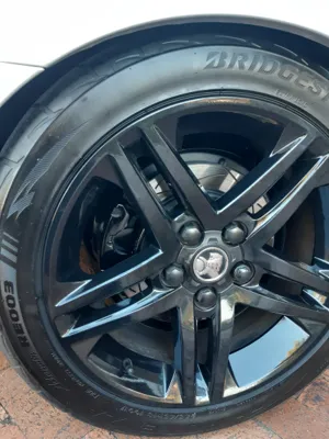 Holden wheel and Bridgestone tyre clean after professional mobile car detailing in Caloundra