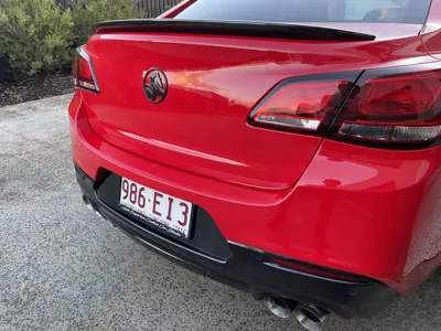 Red Holden rear badge and paint correction from our mobile car detailing team in Caloundra
