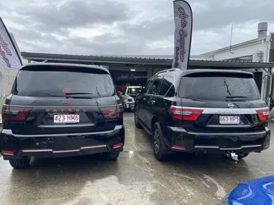 Pair of black Nissan Patrols with GYEON paint protection in Maroochydore